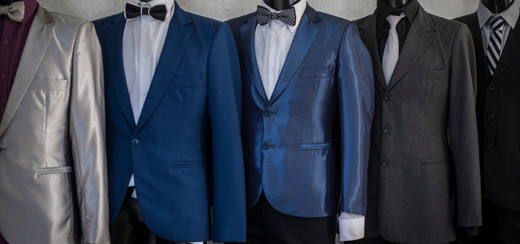 Assorted Colored Suits And Tuxedos For Prom