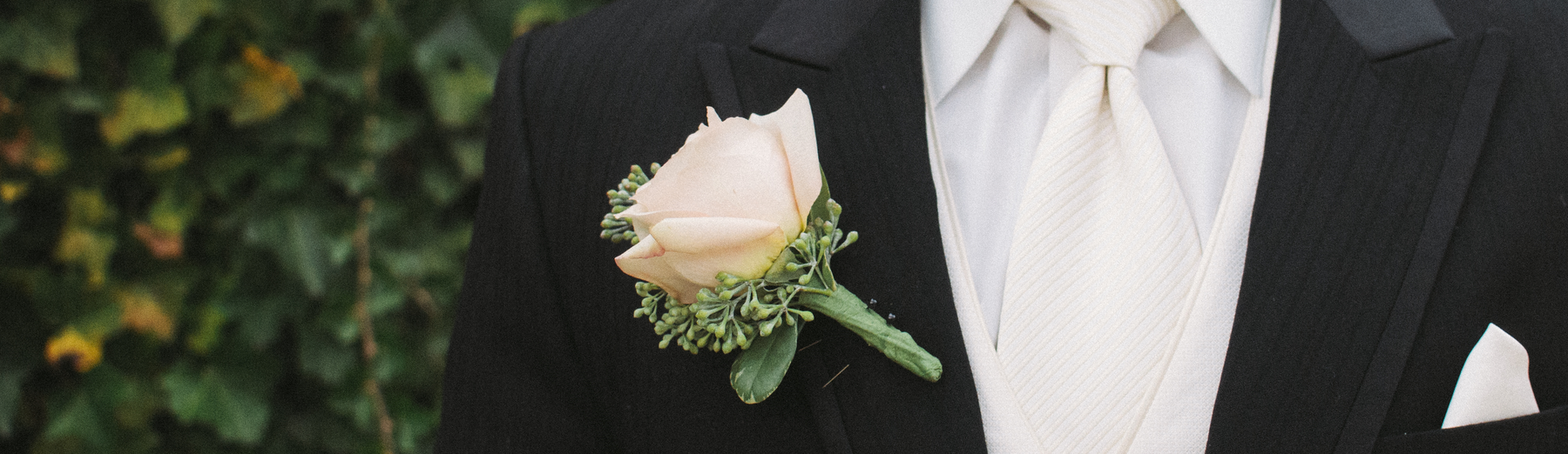 A Floral Boutonniere On A Tuxedo